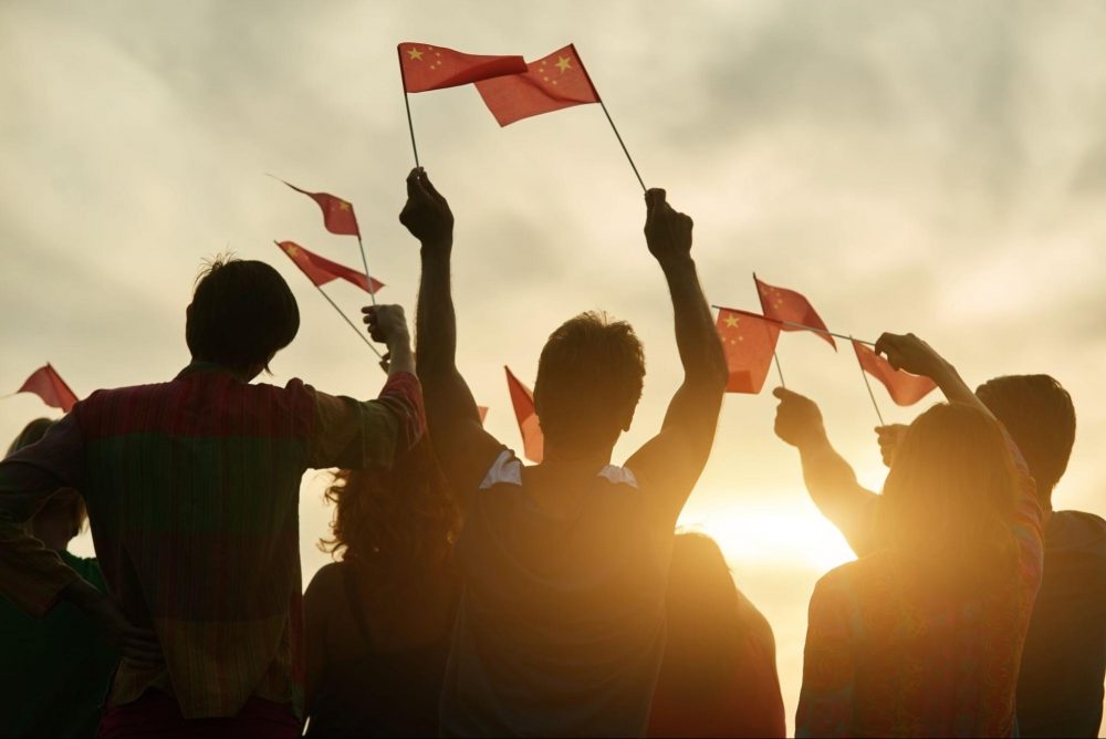 group of people waving chinese flags