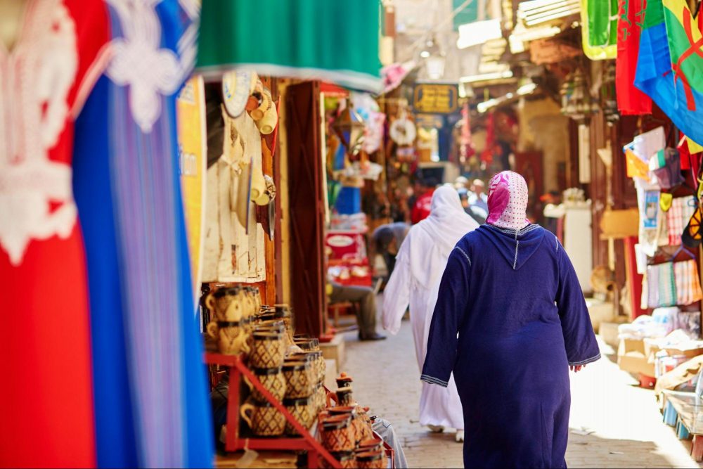 Muslim women walking through a market