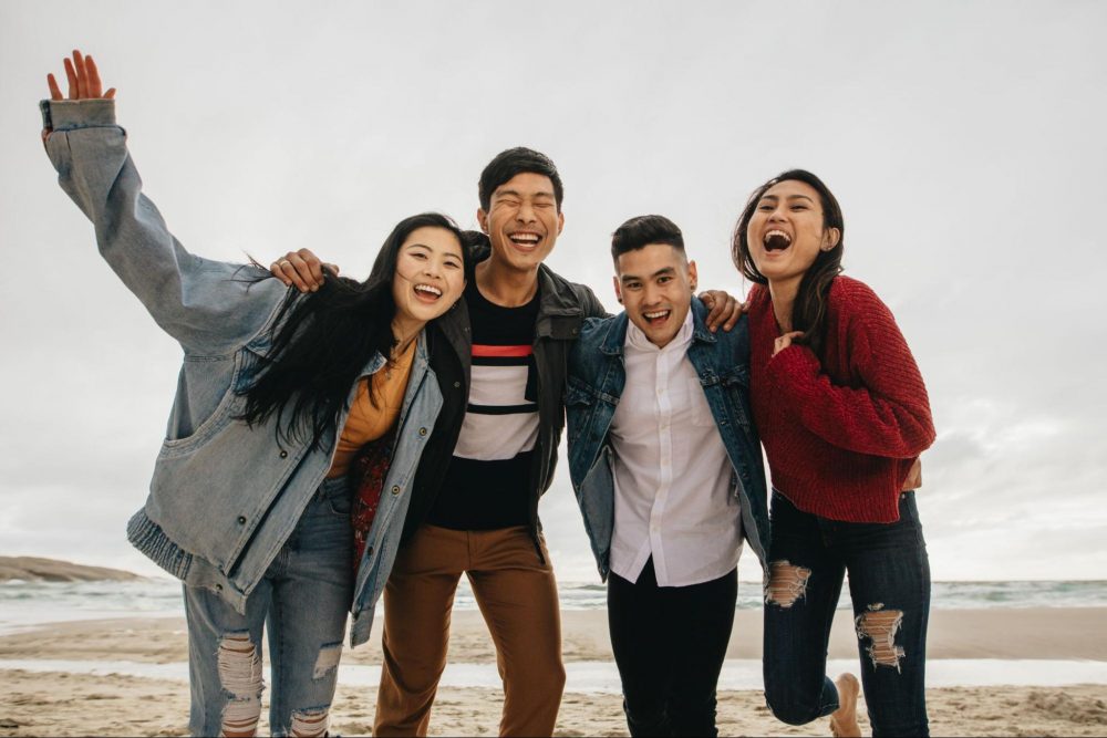 Young Asian people at the beach